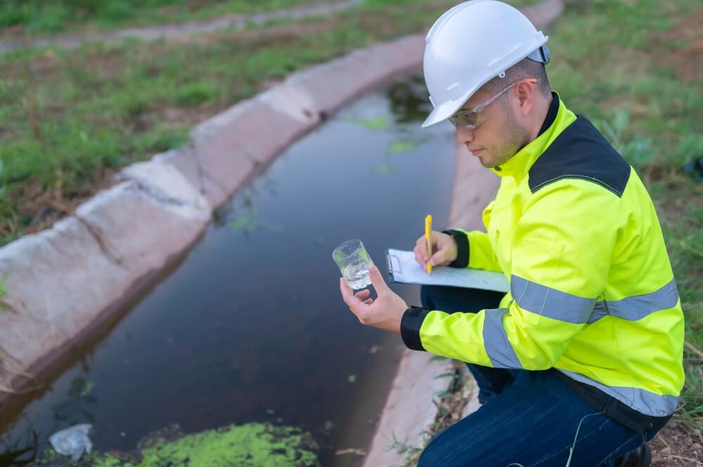 Scientist testing water samples from the dam.